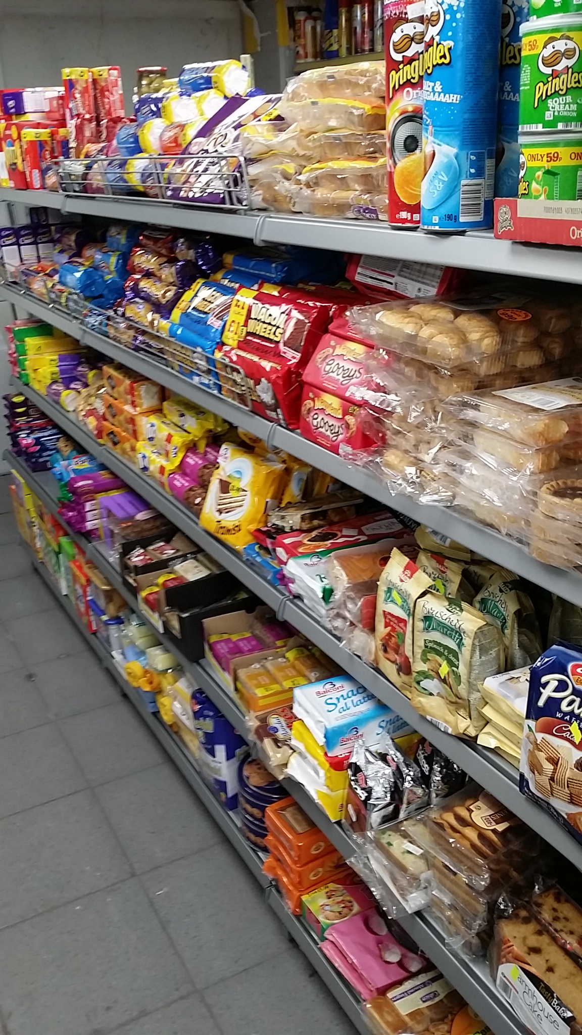 Silver Gondola Shelving in Convenience Store