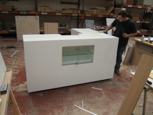 L Shaped Counter With Built In Glass Display Cabinet.