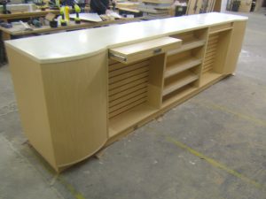 Bespoke Shop Counter with Slatwall Displays and Confectionery Shelves.